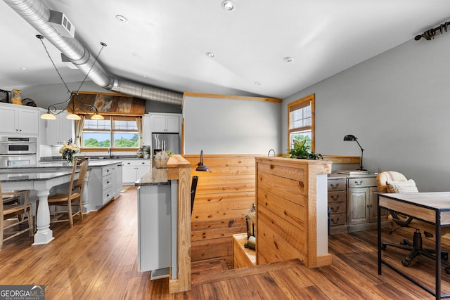 290 Weldon Rd, Fayetteville, GA 30215 - kitchen with a center island, white cabinets, stainless steel fridge with ice dispenser, and wood-type flooring