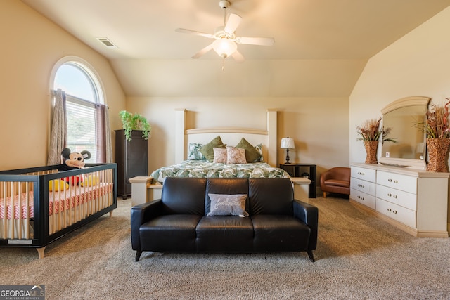 bedroom with carpet flooring, ceiling fan, vaulted ceiling, and visible vents