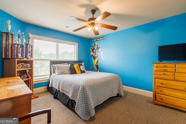 bedroom featuring carpet floors, a ceiling fan, baseboards, and visible vents