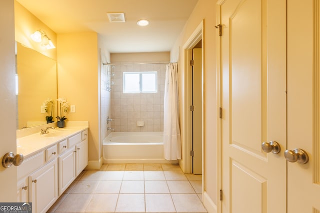 bathroom with tile patterned flooring, vanity, baseboards, shower / tub combo, and visible vents