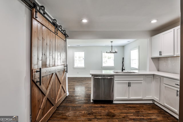 2195 Penelope St NW, Atlanta, GA 30314 - kitchen featuring dishwasher, a barn door, a peninsula, white cabinets, and dark wood finished floors