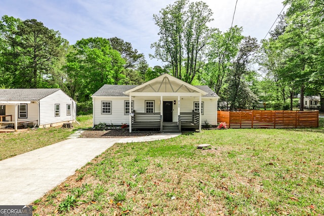 2195 Penelope St NW, Atlanta, GA 30314 - bungalow-style home featuring a porch and view of scattered trees
