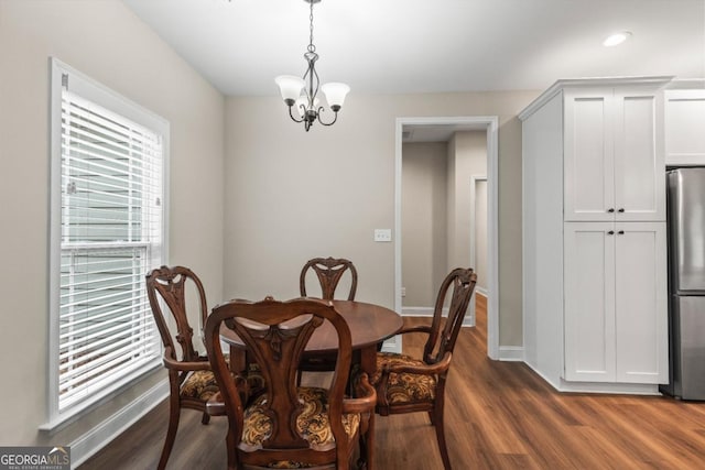 1515 Cabin Creek Trl, Griffin, GA 30223 - dining space featuring baseboards, dark wood-style flooring, and a chandelier