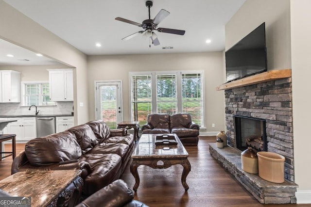 1515 Cabin Creek Trl, Griffin, GA 30223 - living room featuring ceiling fan, a stone fireplace, recessed lighting, dark wood-type flooring, and visible vents