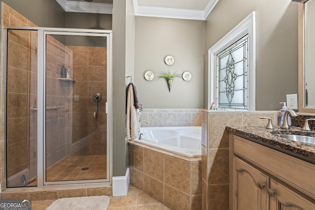 160 Evans Dr, Bogart, GA 30622 - full bathroom with vanity, ornamental molding, a garden tub, a shower stall, and tile patterned floors