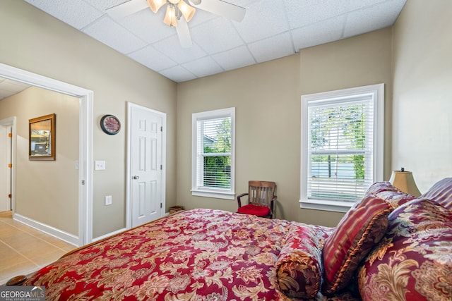 160 Evans Dr, Bogart, GA 30622 - tiled bedroom featuring a ceiling fan, baseboards, and a drop ceiling