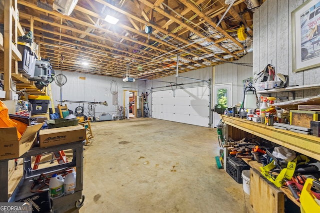 160 Evans Dr, Bogart, GA 30622 - garage featuring a workshop area and a garage door opener