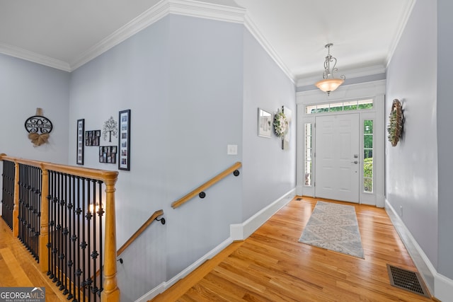 160 Evans Dr, Bogart, GA 30622 - entryway with light wood finished floors, ornamental molding, and baseboards