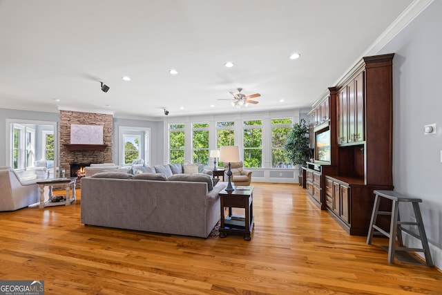 160 Evans Dr, Bogart, GA 30622 - living area with crown molding, a stone fireplace, ceiling fan, light wood-type flooring, and recessed lighting