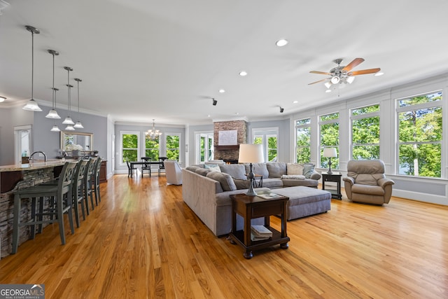 160 Evans Dr, Bogart, GA 30622 - living area with recessed lighting, ceiling fan, light wood-type flooring, a chandelier, and ornamental molding