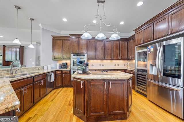 160 Evans Dr, Bogart, GA 30622 - kitchen with stainless steel appliances, a sink, beverage cooler, ornamental molding, and light wood-style floors