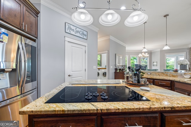 160 Evans Dr, Bogart, GA 30622 - kitchen with separate washer and dryer, stainless steel fridge with ice dispenser, black electric stovetop, crown molding, and a kitchen island