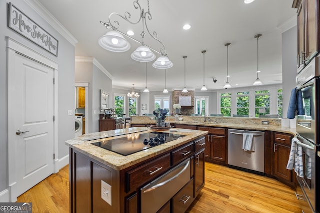 160 Evans Dr, Bogart, GA 30622 - kitchen featuring stainless steel dishwasher, black electric cooktop, ornamental molding, washer / dryer, and a warming drawer