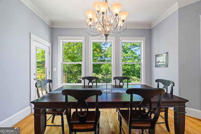 160 Evans Dr, Bogart, GA 30622 - dining space with a chandelier, light wood finished floors, ornamental molding, and baseboards