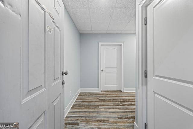 160 Evans Dr, Bogart, GA 30622 - hallway with a paneled ceiling, dark wood-style flooring, and baseboards