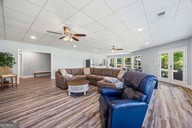 160 Evans Dr, Bogart, GA 30622 - living area with a ceiling fan, a paneled ceiling, wood finished floors, baseboards, and french doors