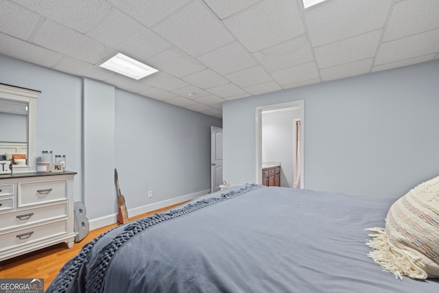 160 Evans Dr, Bogart, GA 30622 - bedroom with wood finished floors, a paneled ceiling, and baseboards