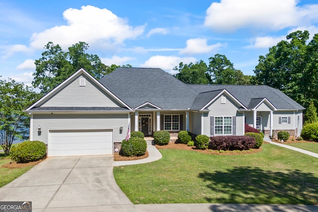 160 Evans Dr, Bogart, GA 30622 - view of front facade with driveway, a front lawn, an attached garage, and stone siding