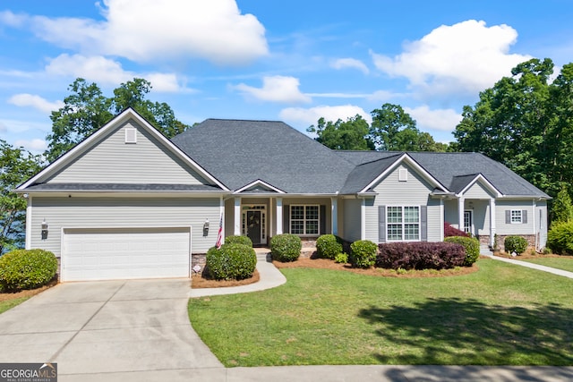 160 Evans Dr, Bogart, GA 30622 - view of front facade with a front yard, driveway, a garage, and roof with shingles