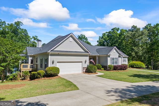 160 Evans Dr, Bogart, GA 30622 - view of front facade with a garage, a front lawn, concrete driveway, a chimney, and stone siding