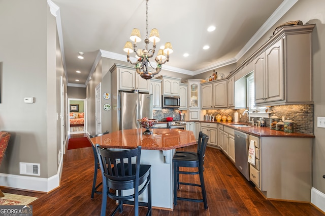 160 Evans Dr, Bogart, GA 30622 - kitchen featuring stainless steel appliances, a sink, ornamental molding, a chandelier, and a breakfast bar area