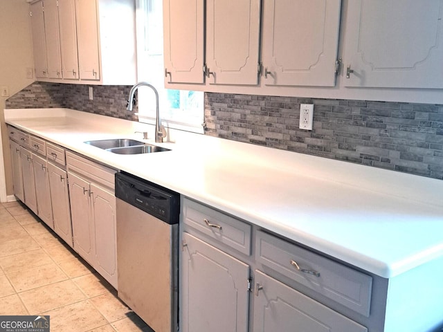 6000 Caribou Dr, Columbus, GA 31907 - kitchen featuring stainless steel dishwasher, a sink, gray cabinetry, and decorative backsplash