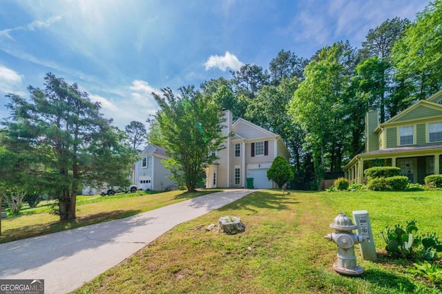 744 Brittany Ct, Stone Mountain, GA 30083 - view of front of home with concrete driveway, a chimney, an attached garage, and a front lawn