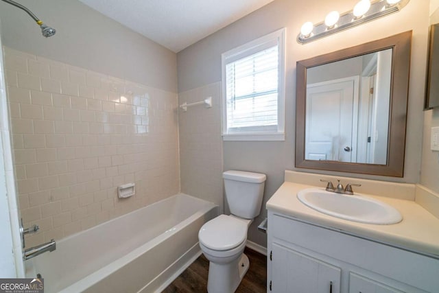 744 Brittany Ct, Stone Mountain, GA 30083 - bathroom featuring vanity, tub / shower combination, and wood finished floors