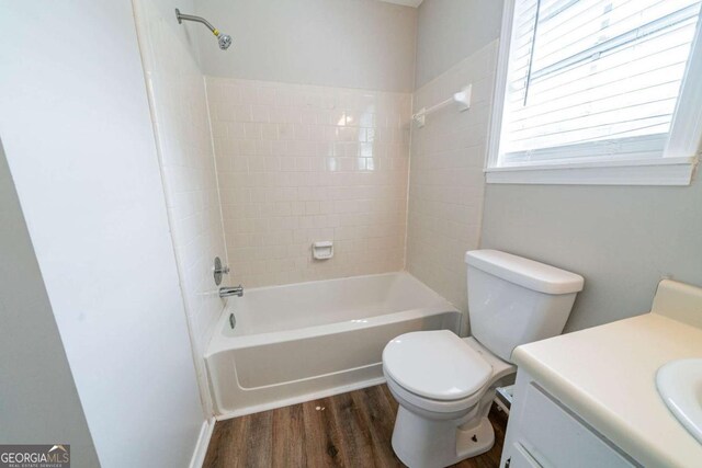 744 Brittany Ct, Stone Mountain, GA 30083 - bathroom featuring shower / bathing tub combination, vanity, toilet, and wood finished floors
