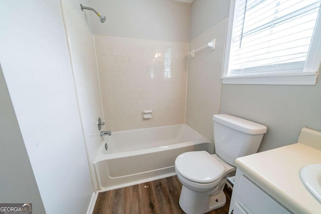 744 Brittany Ct, Stone Mountain, GA 30083 - bathroom with wood finished floors, vanity, and shower / bathtub combination