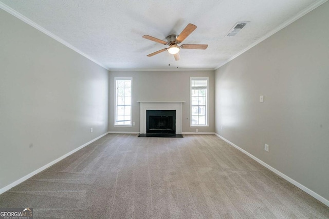 744 Brittany Ct, Stone Mountain, GA 30083 - unfurnished living room featuring crown molding, ceiling fan, carpet, and a fireplace with flush hearth