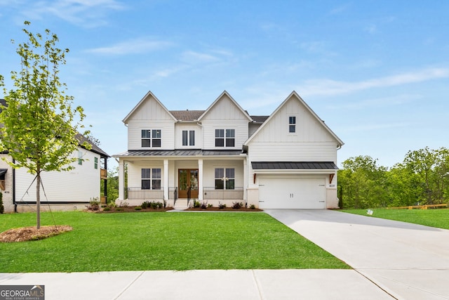 4039 Tallow Pl, Woodstock, GA 30188 - view of front of property with a garage, board and batten siding, concrete driveway, a standing seam roof, and covered porch
