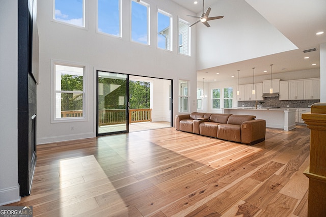 4039 Tallow Pl, Woodstock, GA 30188 - living area with ceiling fan, visible vents, a towering ceiling, light wood-type flooring, and recessed lighting