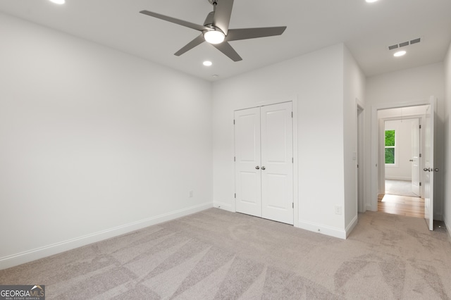 4039 Tallow Pl, Woodstock, GA 30188 - unfurnished bedroom with light colored carpet, recessed lighting, baseboards, visible vents, and a closet