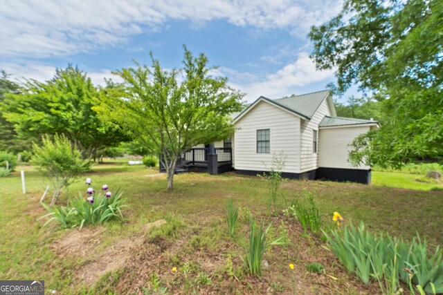 view of yard featuring a wooden deck