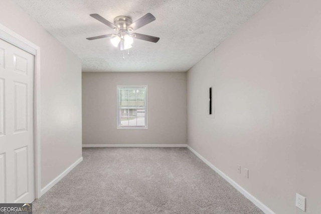 332 Cheryl Ct, Jonesboro, GA 30238 - carpeted spare room featuring a textured ceiling, a ceiling fan, and baseboards