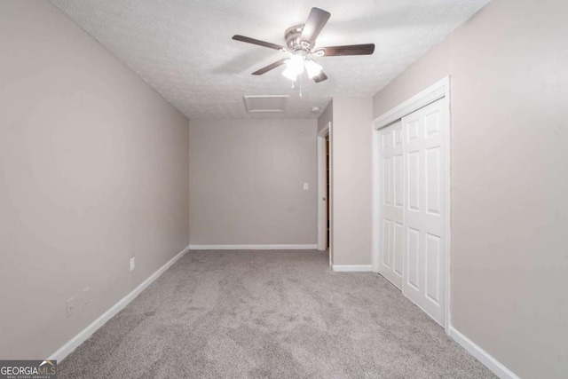 332 Cheryl Ct, Jonesboro, GA 30238 - unfurnished bedroom featuring attic access, carpet floors, a textured ceiling, a closet, and baseboards