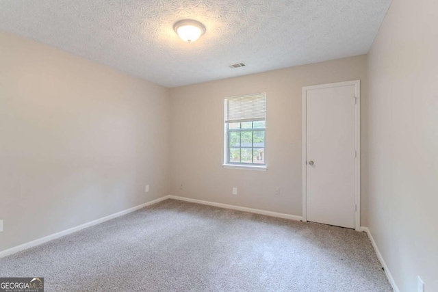 332 Cheryl Ct, Jonesboro, GA 30238 - carpeted spare room featuring a textured ceiling and baseboards