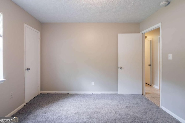 332 Cheryl Ct, Jonesboro, GA 30238 - empty room featuring light carpet, a smoke detector, a textured ceiling, and baseboards