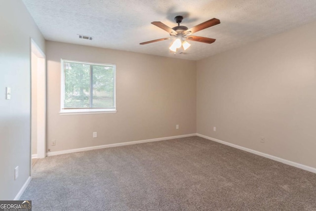 332 Cheryl Ct, Jonesboro, GA 30238 - empty room with ceiling fan, carpet floors, baseboards, and a textured ceiling