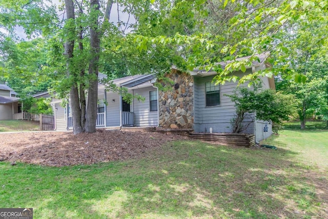 332 Cheryl Ct, Jonesboro, GA 30238 - view of front of house featuring a front lawn and stone siding