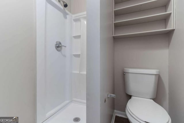 332 Cheryl Ct, Jonesboro, GA 30238 - bathroom featuring a stall shower and toilet