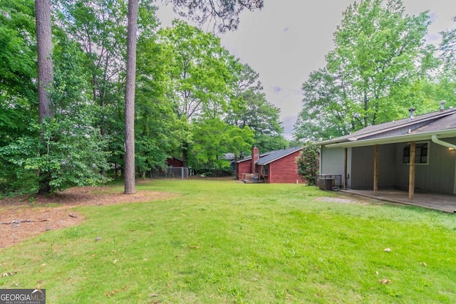 332 Cheryl Ct, Jonesboro, GA 30238 - view of grassy yard featuring central AC