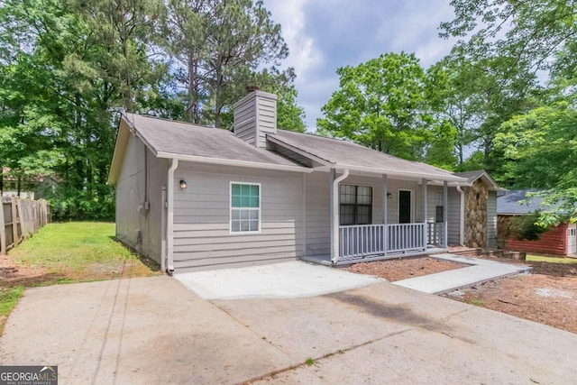 332 Cheryl Ct, Jonesboro, GA 30238 - view of front facade featuring covered porch and a chimney