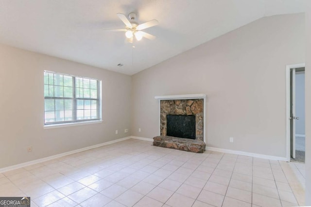 332 Cheryl Ct, Jonesboro, GA 30238 - unfurnished living room featuring lofted ceiling, ceiling fan, light tile patterned floors, a stone fireplace, and baseboards