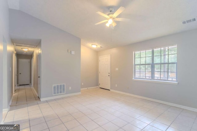 332 Cheryl Ct, Jonesboro, GA 30238 - spare room featuring lofted ceiling, light tile patterned flooring, ceiling fan, and baseboards