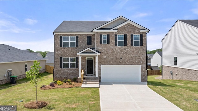 view of front of property featuring an attached garage, a front lawn, fence, and brick siding