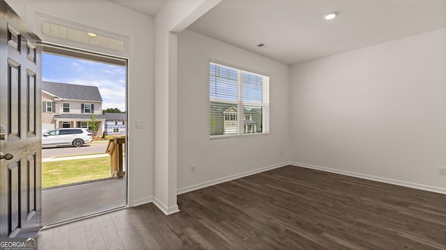 doorway to outside with recessed lighting, baseboards, dark wood-style floors, and visible vents
