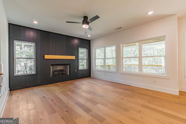 kitchen with white cabinets, visible vents, ceiling fan with notable chandelier, and light countertops
