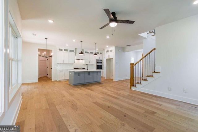 wooden terrace with a ceiling fan